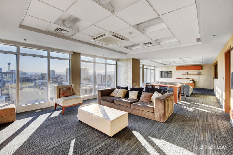 The Ogden Lounge with panoramic city views and modern seating